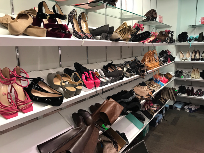 Shoes were haphazardly placed on the racks, similar to an off-price store.