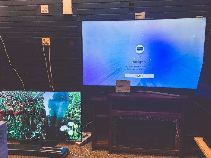 A few TVs were marked as clearance, but one was on the floor, and the wall was bare.