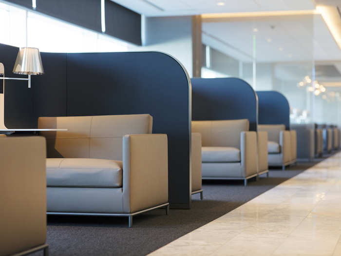 The lounge seating has comfy chairs and privacy boards that, like cubicles, offer fliers privacy to take a call or do sensitive work.