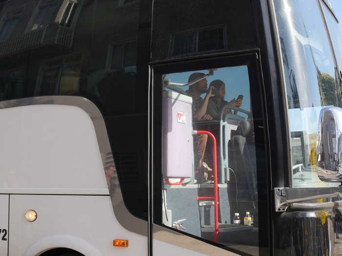 Employees stayed in the buses, which have WiFi, and captured the moment on their phones.