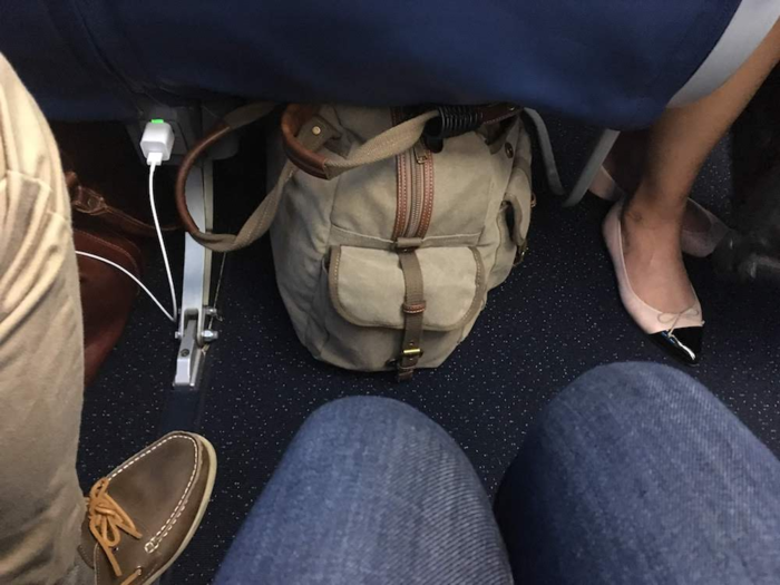 My boyfriend and I ended up not only next to each other, but in an exit row only about half a dozen rows behind first class, so pretty near the front of the plane. I