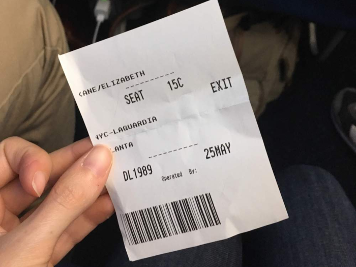 As we boarded, the gate agent took my boarding pass and swapped it for a piece of paper with my seat assignment on it.