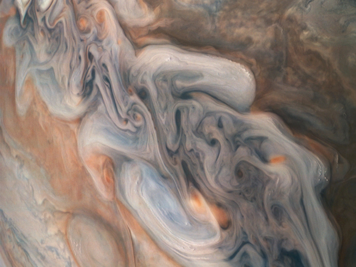 This chaotic strip of storms (from the previous image) is punching into adjacent cloud bands. By the time of Juno