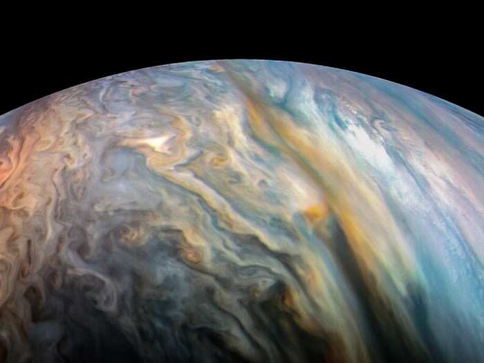 Increasing the color saturation of Juno images also brings out the wide variety of colors lurking in its hydrogen- and helium-rich cloud tops that are peppered with other compounds, including ammonia.