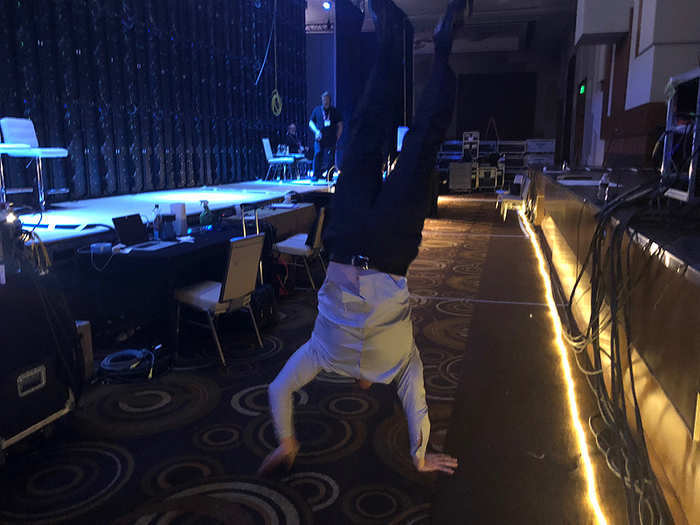 But after her talk, when the whole keynote is over, McKinnon is ready to show off his handstand walking skills again.