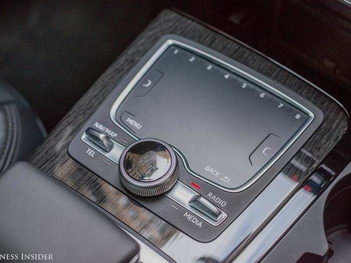 Instead of using a touchscreen, Audi uses a rotary dial controller and a touchpad. It