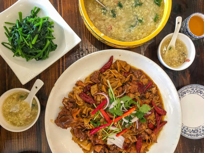 A dish famous in Zhangye is Miao chicken stewed rolls, or braised chicken with mushrooms, peppers, and "flat noodle rolls." It tasted as though it was cooked with spicy oil and cinnamon, a very unique flavor.