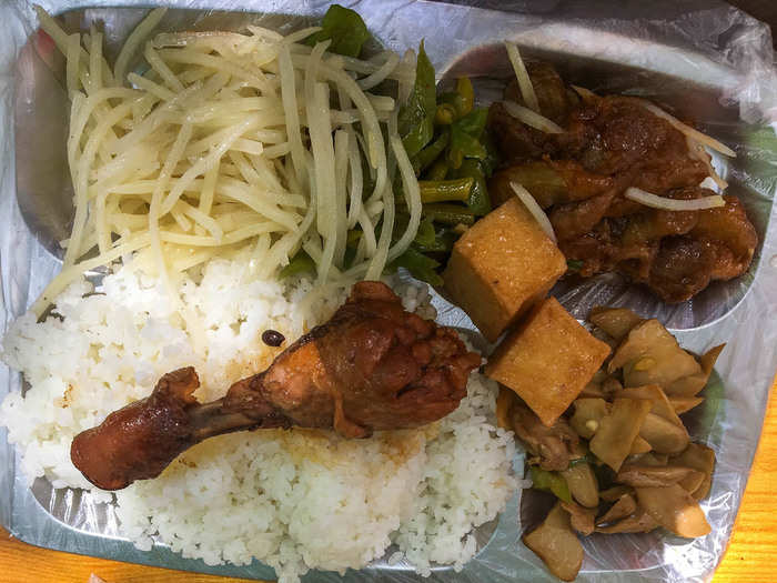 One morning I ate at a street food vendor where all the locals seemed to be eating at for breakfast. It was a set meal where you pick a few items. I went for the shredded potato, braised chicken leg, and tofu.