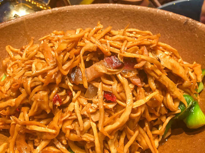 The Tujia restaurant recommended this dish of stir-fried shredded bamboo shoots and pork belly. It came in a sizzling pot and had a smoky, savory flavor.