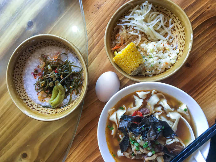 After Hong Kong, I headed to Wulingyuan, a small mountain town in the southwest province of Hunan. The cuisine there is known for being dry and spicy with a liberal use of chili peppers (but not Sichuan peppercorn), as well as numerous dried, cured, smoked, and preserved ingredients. Rice noodle soup, congee with preserved veggies, and a variety of side dishes like corn and shredded potatoes are a typical breakfast.