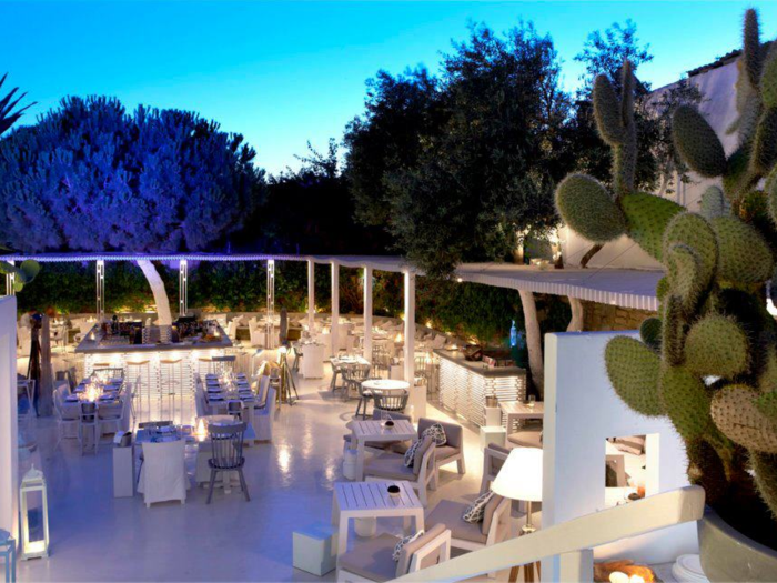 Dine at Interni Mykonos, an open-air dining room off of a secret passageway that transforms into a dance lounge at 2 a.m. ($122,000 for five tables).