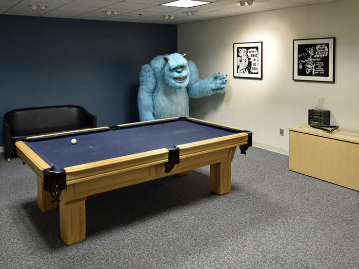 Sully from "Monsters, Inc." broods over a for-sale pool table.