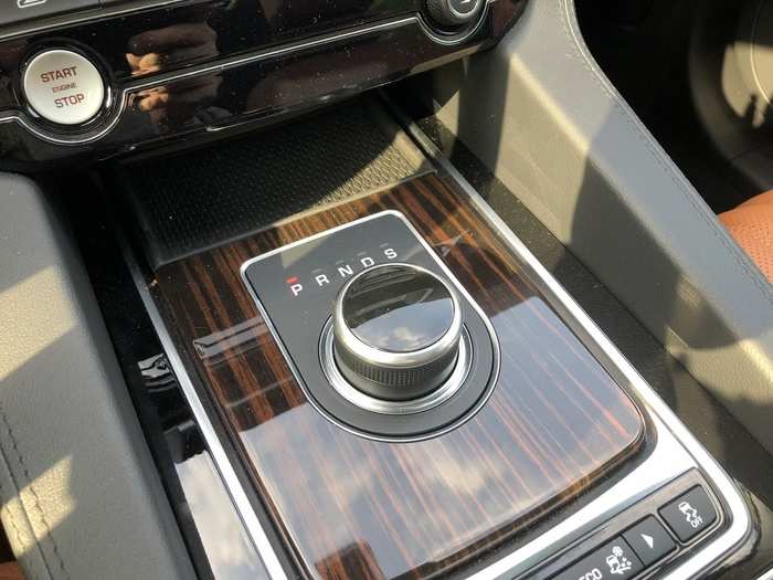 The power from the four-cylinder turbo is piped through an eight-speed transmission. The rotary shift knob rising on startup and retreats when you shut the SUB off. Note the glossy wood trim, as well.