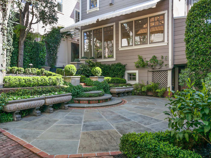 The backyard of the property mirrors the lush, green open space of Alta Plaza Park that spans out from its front stoop.