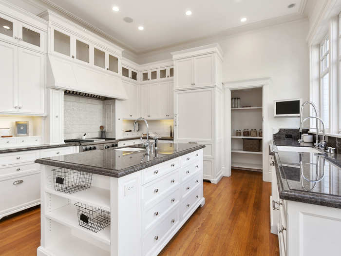 The crisp white seeps into the kitchen as well, where granite counter tops and a breakfast nook can be found.