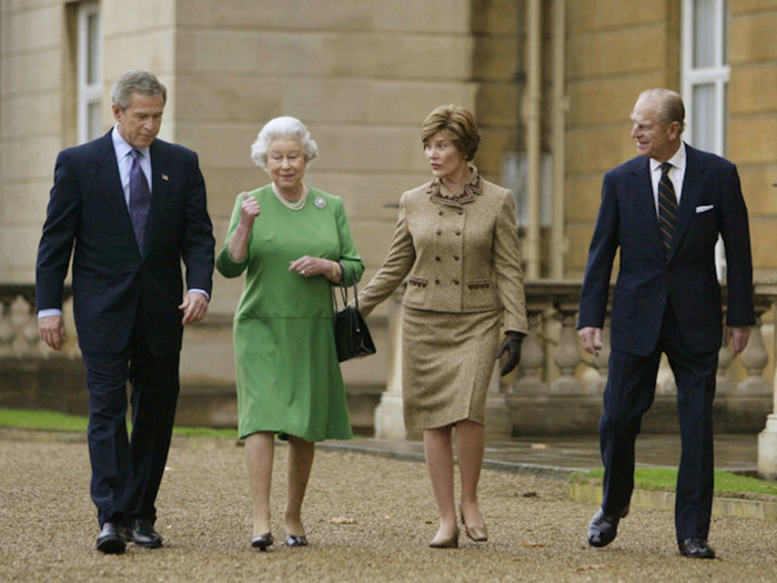 2003: Then-US President George W. Bush visited Britain with his wife Barbara in 2003. The couple can be seen walking with the royals along the west terrace of Buckingham Palace.