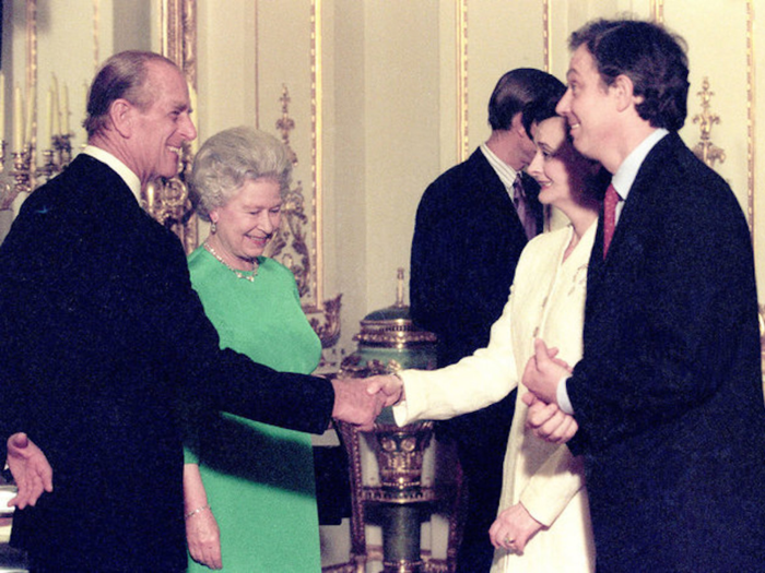 1998: Queen Elizabeth and Prince Philip greet Tony Blair and his wife Cherie at Buckingham Palace in London on the second day of the Asia-Europe meeting. The three days of meetings were dominated by discussions on how the Asian economic crisis was being handled.