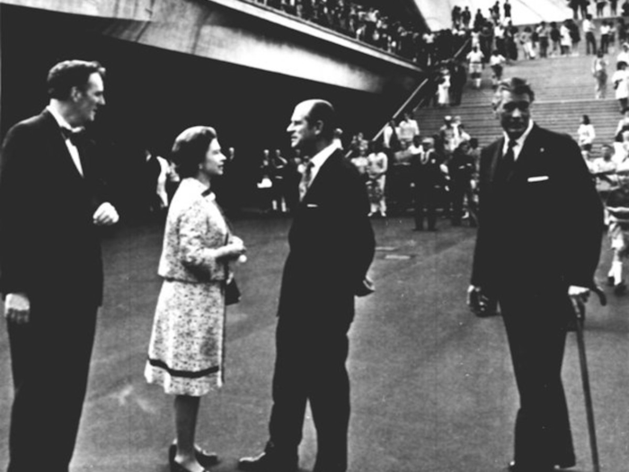 1973: Prince Philip talked to his wife before the new Sydney Opera House complex. Left is Frank Barnes., General Manager of the Opera House and right is Sir Roden Cutler, Governor of New South Wales.