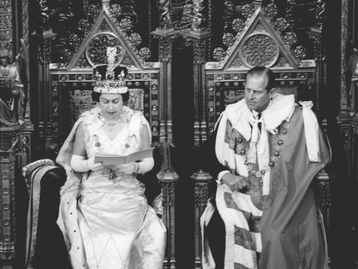 1970: Queen Elizabeth II read her speech in the House of Lords alongside her husband for the State Opening of Parliament in 1970.