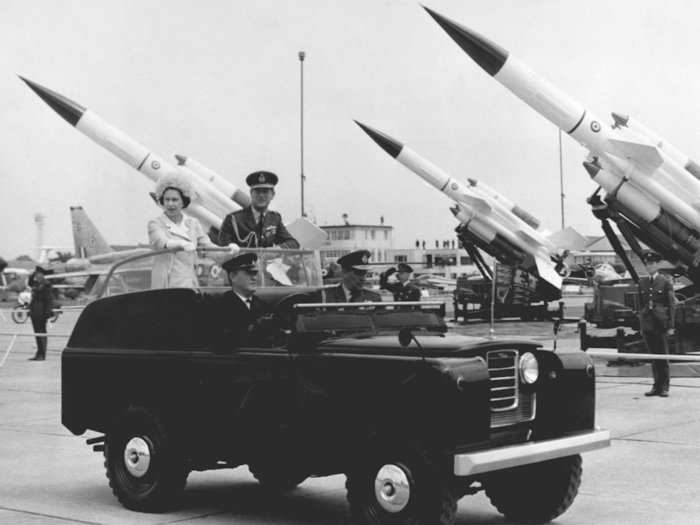 1968: Britain celebrated the 50th anniversary of the formation of the RA Fin style. Here, Queen Elizabeth II and Prince Philip ride past a number of Bloodhound missiles on display during their visit to the Royal Air Force Base at Abington, England.