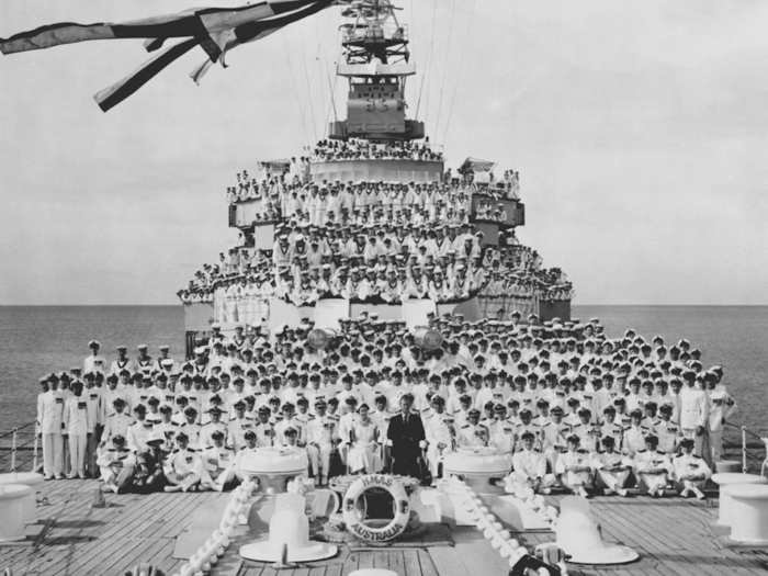 1954: This photo shows the Queen and Duke of Edinburgh during an official visit to HAMS Australia, flagship of the Australian Navy. The Royal couple went aboard during their visit to Cairns, Queensland.