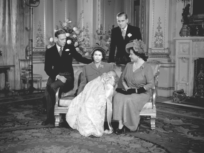 1948: The couple had their first child, Prince Charles, in 1948. In this picture, he sleeps in the arms of his mother, then Princess Elizabeth, after his Christening at Buckingham Palace.