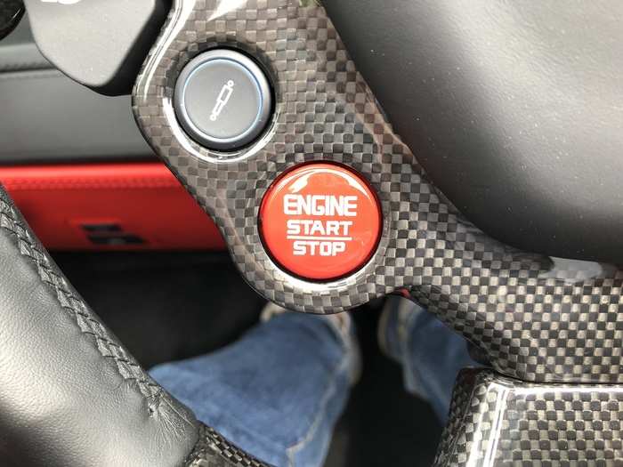 The big red start-stop button is also on the steering wheel. Push it and you