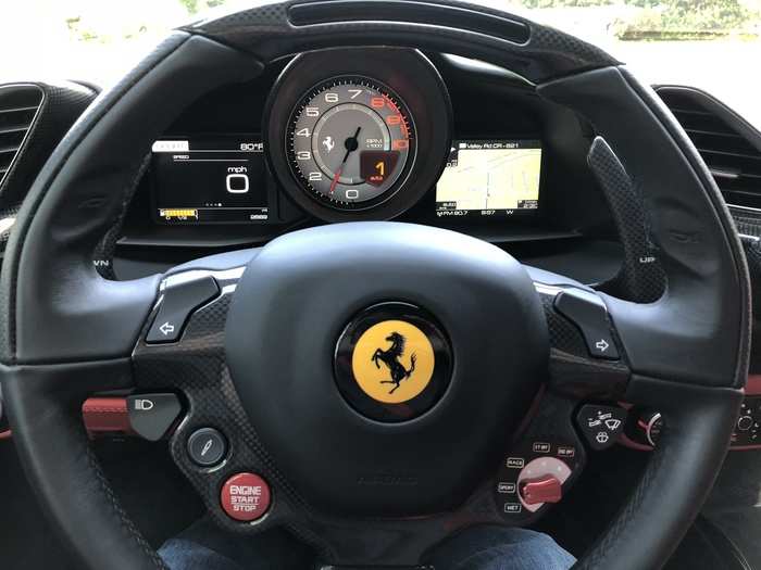 The driver sees a prancing horse, some very large paddle shifters for the dual-clutch seven-speed gearbox (borrowed from Formula One), and the tachometer front and center on the cluster.