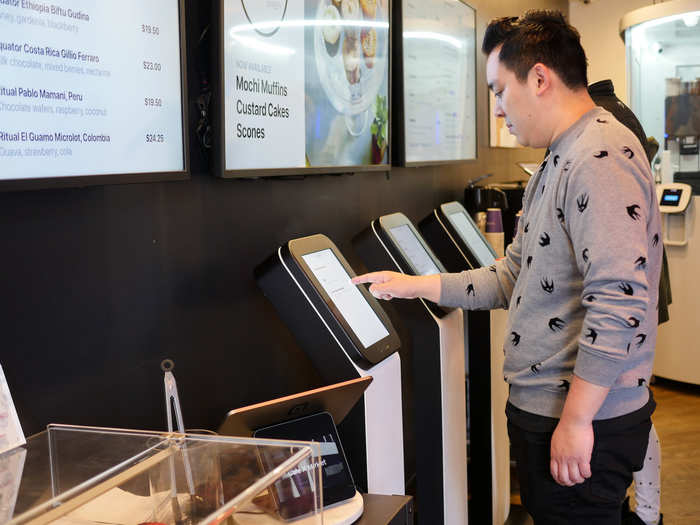 Customers can use on-site kiosks to place their coffee orders.