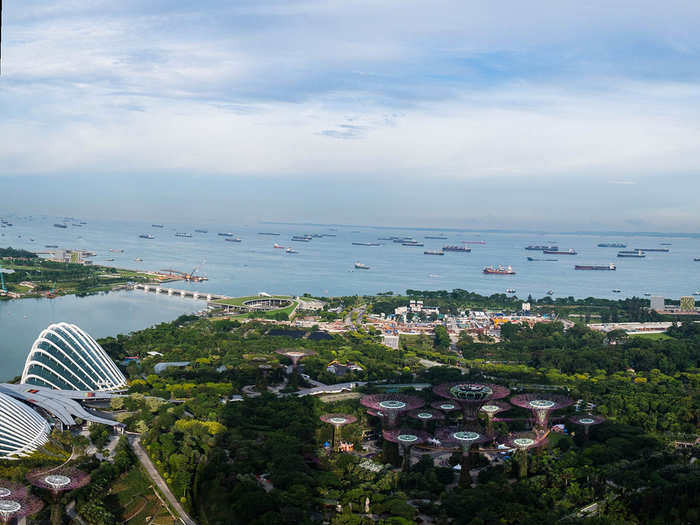 Seriously, the view on the harbor side is incredible. You can get a full view of Gardens By The Bay, and the SuperTree Grove, home to unique vertical gardens that resemble trees. At night, the entire bay, including the SuperTrees, are lit up in neon.