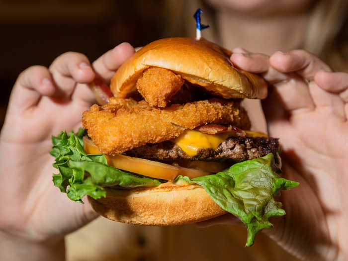 The Cowboy BBQ Burger was a mighty beast, stacked high with onion rings. This was no quiet entrance into the burger business for IHOb. The Cowboy BBQ enters the menu with its deep-fried onion guns blazing.