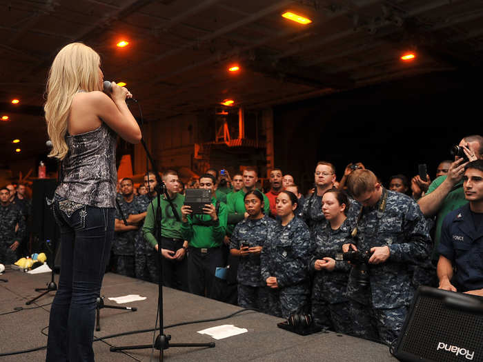 Scanlon performs for the USS Abraham Lincoln crew in 2011.