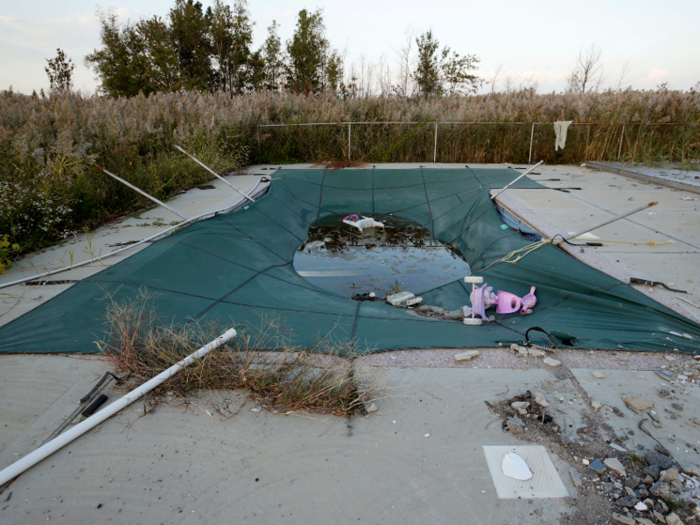 This backyard pool in Staten Island, New York, was abandoned in the wake of Hurricane Sandy in 2013. After the storm ravaged the New York area, the state bought 400 homes and bulldozed them to make room for green space.