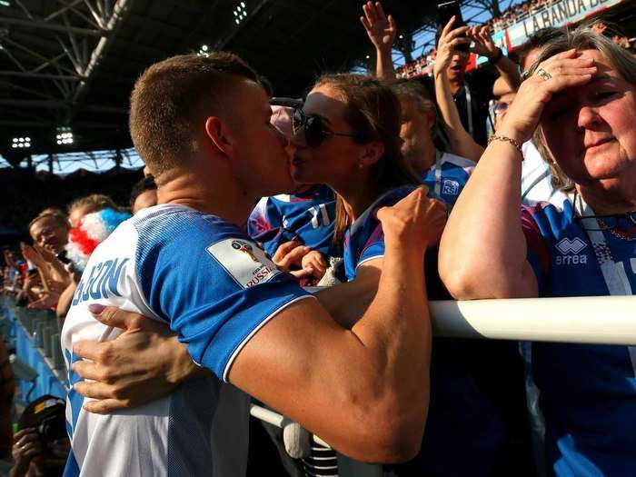 Alfred Finnbogason receives a kiss following Iceland