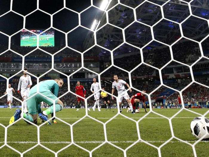 David De Gea watches as he let a ball get by him against Portugal.