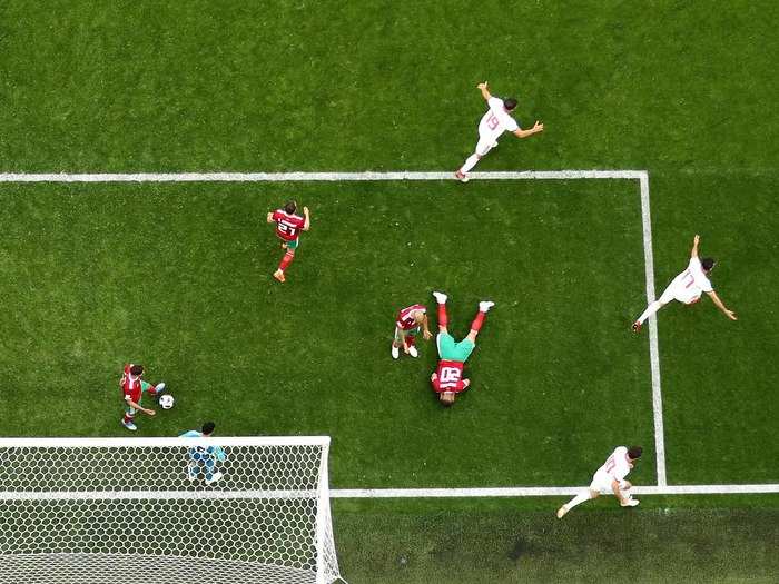 Aziz Bouhaddouz of Morocco lays on the ground after his own goal gave Iran a 1-0 lead.