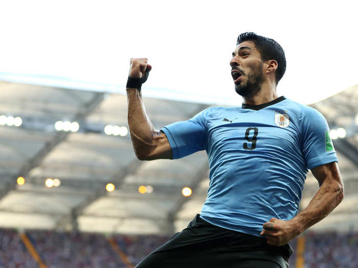 Luis Suarez pumps his fist in the air after giving Uruguay a 1-0 lead over Saudi Arabia.