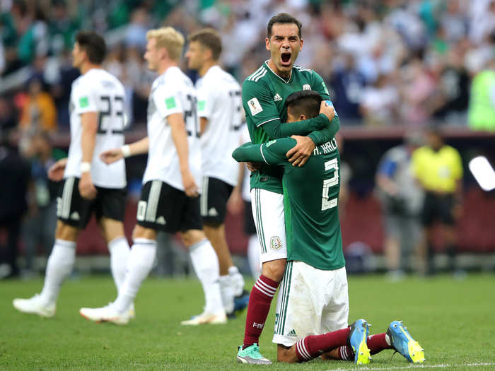 Hugo Ayala and Rafael Marquez embrace after Mexico