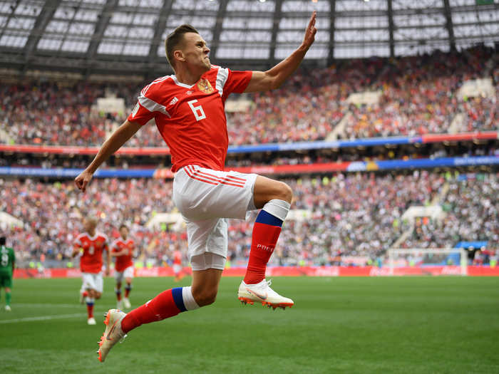 Denis Cheryshev celebrates after scoring to extend Russia