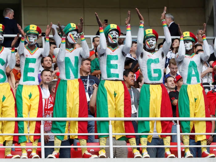 A Reuters photographer got a closer look. They did not stop singing and dancing from the moment they walked into the stadium until after the game ended.