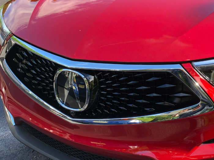 The "A" — styled as a precision-instrument caliper — sits at the center of what Acura calls a "diamond pentagon" grill. It looks cool.