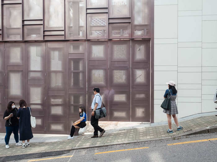 There were more than a few K-Pop fans hanging out by the side door, waiting to see their favorite artist stroll out after a long day of training.