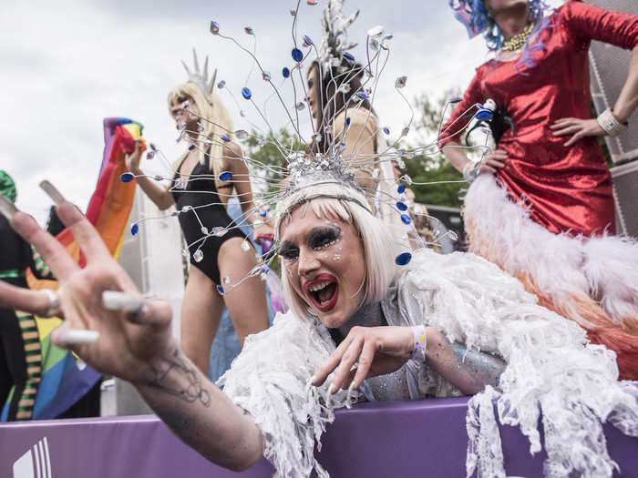 Protected by riot police in Kiev, Ukraine, drag queens in whimsical garb rode on parade floats on June 17.