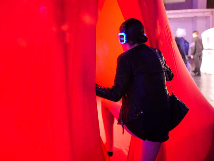 Near the rainbow throne was "The Womb," a red, inflatable capsule meant to simulate the tranquility of being in Utero. Guests removed their shoes, took the provided headphones, and stepped inside.