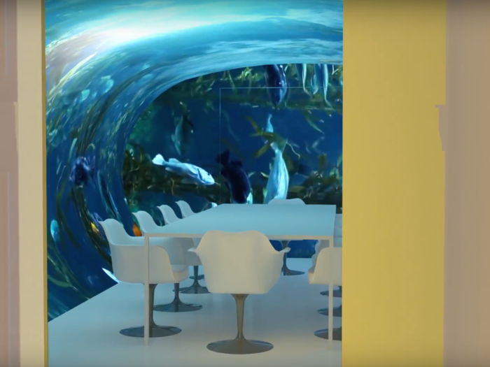 One of the doors opens onto an oval boardroom with a curved TV screen, playing 3D panoramas.