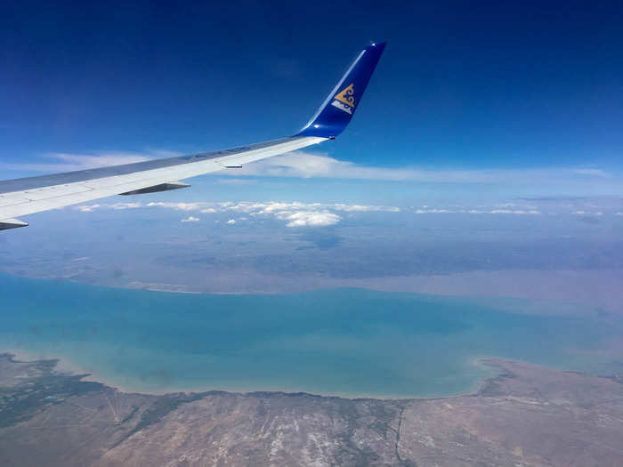 I’m not sure what I was flying over when I saw this, but this blue-green lake was unbelievable looking. AirAstana primarily operates in Asia, Eastern Europe, and Russia. The landscape was stunning the whole time we were flying.