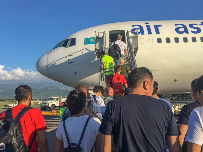 My flight was on time. After checking our passports at a small gate inside the airport, we boarded a bus that drove us to the plane on the tarmac. There