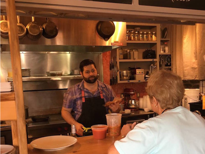 It has an open kitchen so that customers can watch Chef Matt Adams in action.