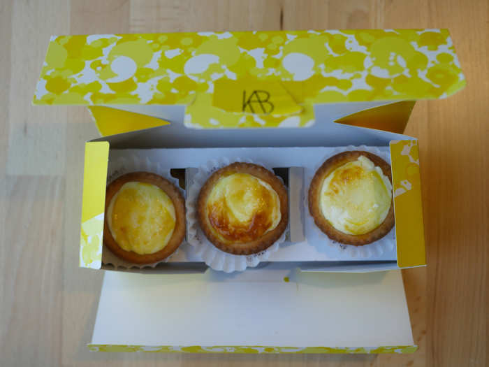 The presentation was solid, with each tart nestled into its own paper wrapper. Three sat on the bottom of the box, underneath three more perched above them on cardboard.