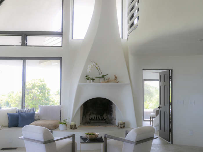 A contemporary angular fireplace graces the main level